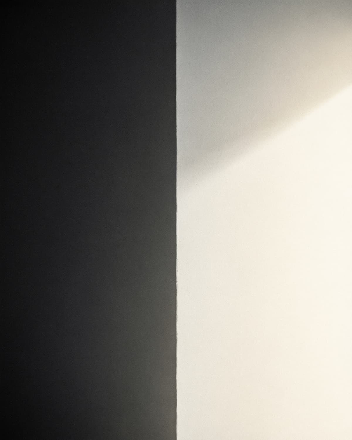 Abstract black-to-white gradient photograph, evoking a mailbox gradually warming up